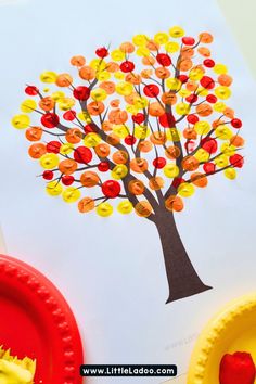 an apple tree made out of buttons on paper