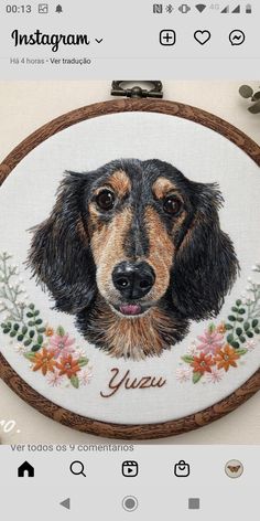 a dog is shown on the applique in this embroidery pattern, which features flowers and an image of a dachshund