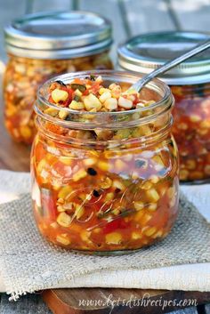 canned corn salsa in a glass jar with a spoon