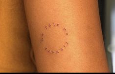 a woman's arm with the word faith written in cursive writing on it