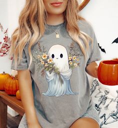 Boho Halloween Ghost shirt/ Boho Halloween/ Ghost Shirt/ Women's Halloween Shirt/ Halloween These ultra soft pigment dyed shirts are one of our best sellers, 100% Cotton. - 100% ring spun cotton - Preshrunk, soft-washed, garment-dyed fabric - Set-in sleeves - Double-needle stitched sleeves and bottom hem - Twill taped shoulder-to-shoulder - 1" ribbed collar with double-needle topstitched neckline Sizing: - Shirts are unisex fit. For a relaxed fit, we recommend that you choose your go to size to Spooky Cotton Shirt For Halloween, Halloween Soft-washed Short Sleeve T-shirt, Boho Halloween, Oversized T Shirt Dress, Dye Shirt, Ghost Shirt, Halloween Women, Fall Shirts, Halloween Ghosts