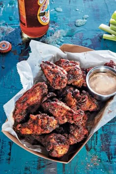 chicken wings with dipping sauce on the side