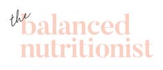 the balanced nutritionist logo is shown in black and pink letters on a white background