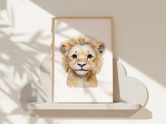 a painting of a lion is displayed on a shelf next to a shadow cast wall