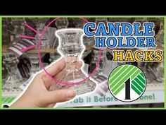 a hand holding a glass bottle with the words candle holder hacks in front of it