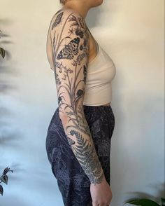 a woman with a tattoo on her arm