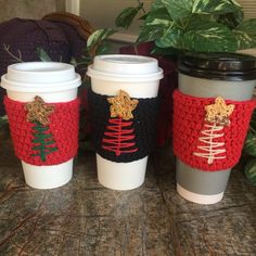 three coffee cups sitting next to each other on a table