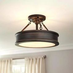 a light fixture hanging from the ceiling in a living room