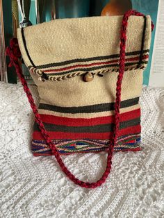 Handcrafted woven shoulder bag Made in Morocco,in the Atlas Mountains,  this boho wool bag is Handmade by local artisans  Made of Organic Wool & Cotton This item is handcrafted and is vintage therefore may have imperfections or irregularities. These should not be considered as flaws, but rather an addition to their beauty and originality.  Please see all pictures as they are part of the description, and ask any questions prior to purchase  In very good vintage condition Traditional Handwoven Crossbody Shoulder Bag, Beige Woven Shoulder Bag For Travel, Traditional Handwoven Crossbody Bag, Beige Woven Tote Shoulder Bag, Vintage Handwoven Satchel Shoulder Bag, Bohemian Shoulder Bag With Weaving Details, Vintage Handwoven Bags For Market, Artisan Handwoven Pouch Shoulder Bag, Handwoven Pouch Shoulder Bag For Market