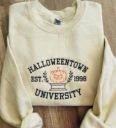 Embroidered Halloween University sweatshirt ! * Choose your wording color : white or black/image!   Swetashirt Description:  -Material is 50%cotton and 50%polyester. -This is unisex fitting sweatshirt:Size chart is listed in images!  -Size up for Oversize Look! **Shirt is made to order, and processing times is estimated 4-5  business days!  *Due to nature of Handmade goods this order is not allowed for returns or exchanges, but if you have any concerns, please do contact me and I would be happy Halloween University, Embroidered Halloween, Pumpkin Sweatshirt, Pumpkin Sweatshirts, University Sweatshirts, Black Image, Halloween Town, Halloween Sweatshirt, Fall Sweatshirt