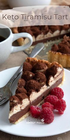 there is a piece of cake on the plate with raspberries next to it