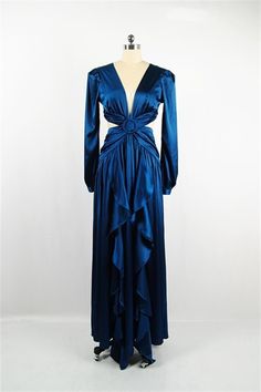 𝑫𝒆𝒔𝒄𝒓𝒊𝒑𝒕𝒊𝒐𝒏: Cut-out along a plunging buckled bodice, ruffles their floor-skimming gown in a silky Blue satin. Back tie and zip closure. ∙Model wearing size Small 𝑺𝒊𝒛𝒆 𝑪𝒉𝒂𝒓𝒕: • 2-4 Small • 6-8 Medium • 10-12 Large 𝑺�𝒉𝒊𝒑𝒑𝒊𝒏𝒈 • This Item ships for free. 𝑹𝒆𝒕𝒖𝒓𝒏𝒔 • Returns (For store credit only) accepted within 30 days after your package has been delivered. 𝑪𝒂𝒏𝒄𝒆𝒍𝒍𝒂𝒕𝒊𝒐𝒏𝒔 • Can be canceled within 30 min. Satin Maxi Dress With V-neck And Ruffles, Satin Maxi Dress With Ruffles And V-neck, Satin V-neck Maxi Dress With Ruffles, Blue Silk Maxi Dress With Ruffles, Mykonos Blue, Satin Maxi, Satin Maxi Dress, Blue Satin, Mykonos