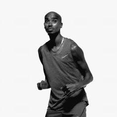 a black and white photo of a man running