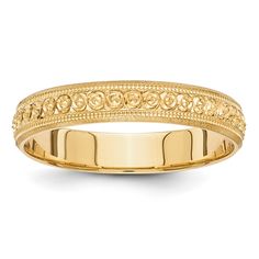 a yellow gold wedding ring with filigrees