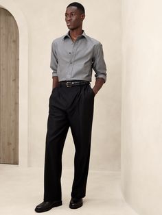 Designed for ease of wear and care, this sleek dress shirt employs a special cotton fabric with PUREPRESS™ cotton technology, a special process that smooths and protects the fabric, resulting in a wrinkle-resistant finish.  Slim fit with darts at the back.  Spread collar.  Shirttail hem.  Slim fit.  Long sleeves.  Hip length.  Model: Size M, 6'2" (188cm). Mens Homecoming Outfits, Gray Shirt Outfit, Homecoming Outfit, Pants Outfit Men, Sleek Dress, Men Formal, Men Shirt Style, Grey Shirt, The Gap