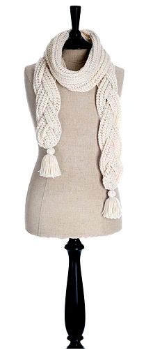 a white knitted scarf on top of a mannequin