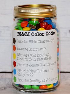 a jar filled with lots of colorful candy