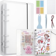 an open planner book with stickers, scissors, and other items to make it personalized