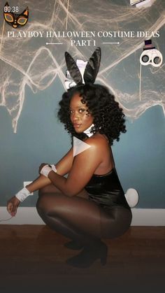 a woman sitting on the floor wearing bunny ears