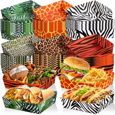 several different types of food in boxes with zebra print designs on the sides, including sandwiches and french fries