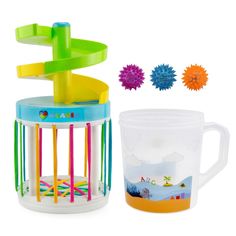 a plastic cup and some colorful objects on a white background