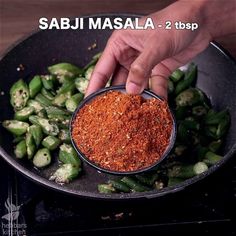 someone is adding seasoning to green beans in a skillet with the words sabi masala - 2 tsp