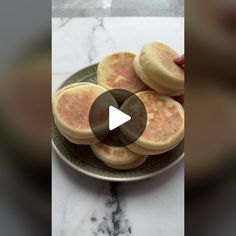 a plate filled with pancakes on top of a marble counter