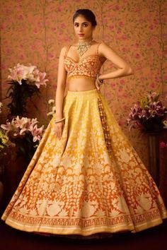 Spectra yellow sun orange attached cancan ombre lehenga with floral abstract brocade applique. Paired with a padded orange blouse with coordinating work and stone danglers. Comes along with a dupatta and belt. - Aza Fashions Fitted Orange Traditional Wear For Wedding, Yellow Wedding Choli With Motifs, Wedding Yellow Choli With Motifs, Fitted Sleeveless Traditional Wear For Wedding, Fitted Wedding Dress With Motifs, Orange Lehenga With Motifs For Wedding, Orange Wedding Lehenga With Motifs, Wedding Orange Lehenga With Motifs, Wedding Orange Choli With Motifs