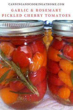 two jars filled with pickled cherry tomatoes