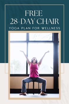 a woman sitting on top of a chair in front of a window with her arms up