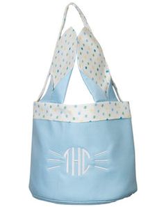 a blue and white cat bag with polka dots on the front, two ears at the bottom