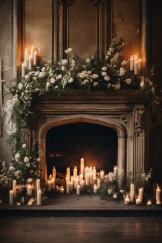 a fireplace decorated with candles and flowers