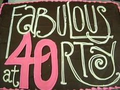 a chocolate cake with pink frosting that says fabulous at forty