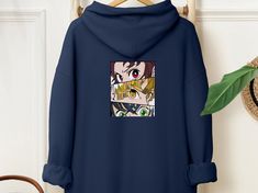 Vintage Anime hoodie, Japanese Anime lover gift, Anime merch, Anime Lover Sweatshirt, Sweater, Gift for anime fan, Retro y2k Style,  1. Order Process: * Choose the Size and the Color of the Hoodie from the drop-down menus. * Add to your cart and check out 2. MATERIAL Gildan 18500, medium-heavy fabric blend of 50% cotton and 50% polyester 3. SIZES  Please check the size chart before you purchase. S to 4XL sizes are available in stock. 4. SHIPPING  Processing times depend on the designs.  Domestic shipping 1-7 Days 5. CARE INSTRUCTIONS Machine wash warm, inside out, with like colors. Only non-chlorine bleach. Tumble dry-low. Medium iron. Do not iron decoration. Do not dry clean. Anime Style Sweatshirt With Anime Print For Fans, Vintage Anime, Eyes Wallpaper, Lover Sweatshirt, Anime Lover, Anime Merch, Iron Decoration, Anime Hoodie, Sweater Gift