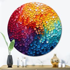 a colorful circular painting on the wall above a table