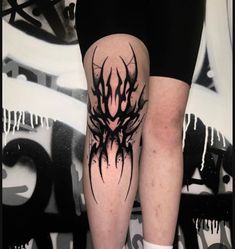 a person with black ink on their legs