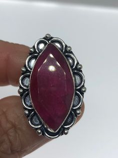 Unusual deep toned raw Ruby low content silver setting handmade size 8 Can be resized. My jeweler charges a $10- $20 fee All rings are shipped in a nice gift box. Check out our over a THOUSAND great reviews Engraving is $4 per letter and is not always perfect depending on the piece. It can take a few days if the jeweler is busy. This is payable to Paypal Judithsltd@gmail.com Silver Ruby Ring Collectible, Unique Handmade Oval Ruby Ring, Antique Untreated Jewelry Gift, Unique Handmade Ruby Ring Gift, Unique Handmade Ruby Ring As Gift, Handmade Spiritual Ruby Ring As Gift, Handmade Spiritual Ruby Ring For Anniversary, Handmade Spiritual Ruby Ring For Gift, Handmade Antique Sterling Silver Ruby Ring