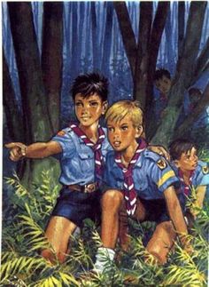 two young boys sitting on the ground in front of some trees and bushes, with their arms around each other