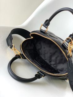 This Alma BB handbag inherits the essence of Art Deco style in the 1930s. It is a rich quilted calfskin embroidered Monogram pattern, with a rolled leather handle and a detachable and adjustable shoulder strap. It can be carried cross-body Convert as you like.

Size: 24.5 x 18.0 x 12.0 cm (LxHxW)
• Quilted and embroidered smooth calfskin
• Nano Monogram jacquard lining
• metallic parts
• Double zip closure
• Interior patch pocket
• Bottom nails
• Shoulder strap: detachable and adjustabl Business Leather Quilted Bag, Quilted Leather Business Bag, High-end Quilted Shoulder Bag For Everyday Luxury, Luxury Shoulder Bag With Adjustable Strap And Round Handle, Luxury Quilted Shoulder Bag For Everyday Use, Luxury Quilted Satchel Bag, Classic Quilted Bag For Daily Use, Designer Quilted Top Handle Bag, Luxury Quilted Double Handle Bag