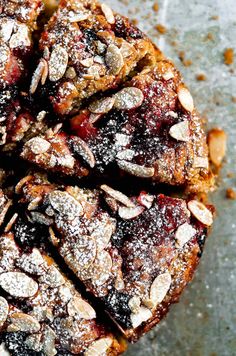 a cake with almonds and blueberries on top