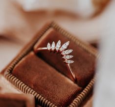 a close up of a ring in a box