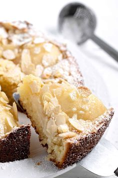 a close up of a cake on a plate with a slice taken out of it