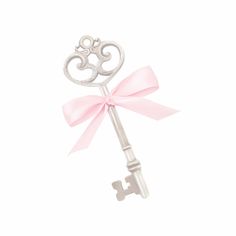 a silver key with a pink bow on it