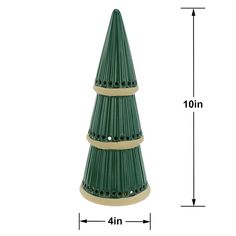 a green christmas tree sitting on top of a white table next to a ruler and an image of the height