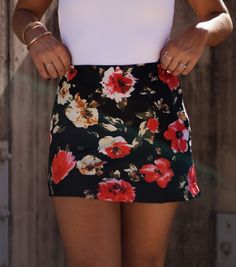 Unleash your playful side with our Floral Elegance Mini Skirt. Perfect for any occasion, this skirt features a beautiful floral pattern and exudes elegant charm. Let your style bloom with this must-have addition to your wardrobe. Fabric 100% polyester Zipper in back. Elegant Floral Print Bottoms For Brunch, Chic Skirted Bottoms With Floral Print, Chic Floral Print Skirt, Black Floral Print Skirt For Summer, Floral Print Flared Skirt For Garden Party, Floral Print Skirt For Brunch, Floral Print Flared Skirt For Brunch, Chic Mini Skirt With Floral Print, Floral Print Relaxed Skirt For Brunch