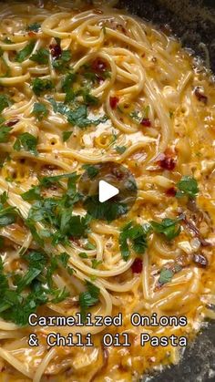 a bowl filled with pasta and garnished onions