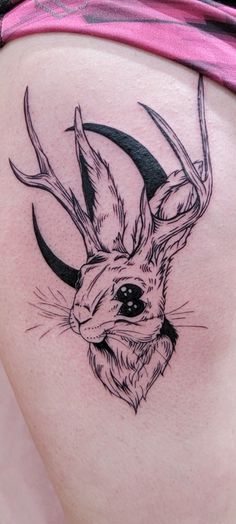 a woman's thigh with a deer tattoo on it