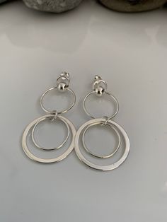 *ITEM DESCRIPTION* These lovely sterling silver circle statement earrings comprises of multiple sterling silver circle charms attached to a sterling silver stud fixings and butterfly style earring backs. All parts on these earrings are 100% sterling silver.    Each earring measures approx 2 inches in length from where the earring stud to the bottom of the lowest silver circle charm These gorgeous earrings come beautifully presented in a Loved By Venus gift box making them a lovely gift. For hygi Earrings Long Silver, Silver Circle Earrings, Butterfly Style, Birthday Bracelet, Earrings Summer, Summer Earrings, Earring Stud, Long Drop Earrings, Silver Circle