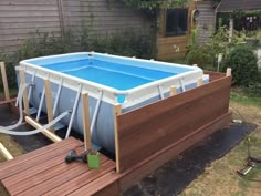 an above ground swimming pool in a backyard