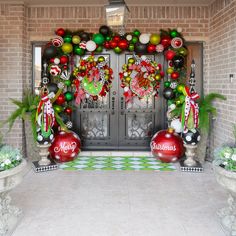 an entrance decorated with christmas decorations and ornaments